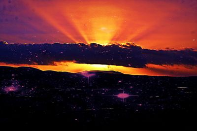 Scenic view of dramatic sky during sunset