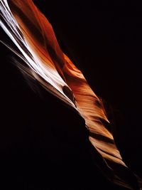 Low angle view of light painting against black background