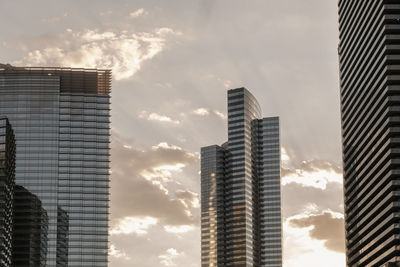 Low angle view of modern buildings against sky