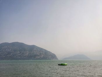 Scenic view of lake against sky and mountain