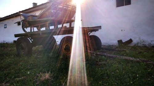 Panoramic view of abandoned cars on field