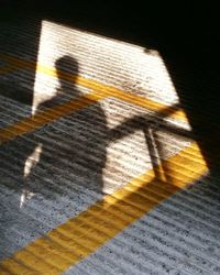 Close-up of shadow on city street