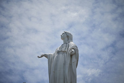 Low angle view of statue against sky