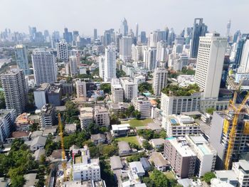 High angle view of buildings in city against sky