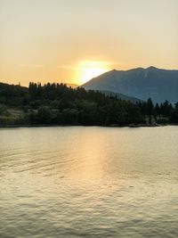 Scenic view of lake against sky during sunset