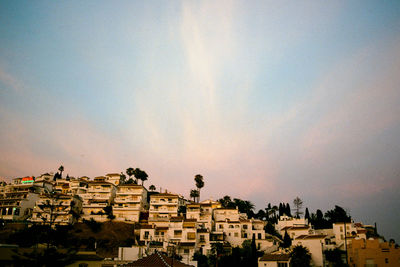 Low angle view of cityscape against sky