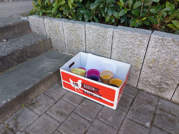 High angle view of information sign on footpath