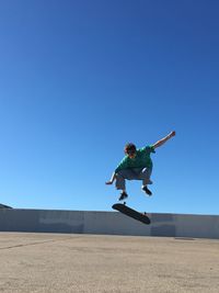 Wide shot of skateboarding kickflip