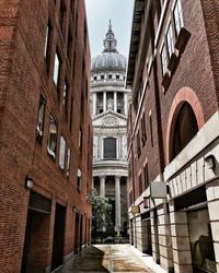 Alley amidst buildings in city