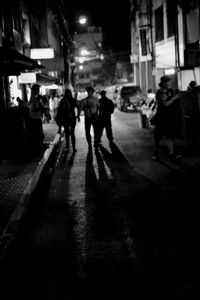 People on city street at night