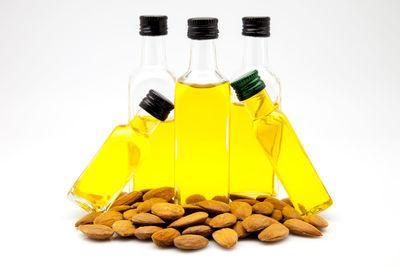 Close-up of yellow bottle against white background