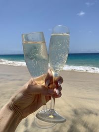 Close-up of hand holding drinks 