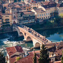 High angle view of bridge over river against buildings