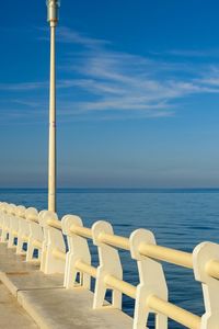 Built structure on beach against blue sky