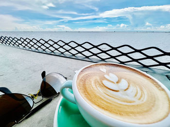 My latte, old rayban, sea and sky..