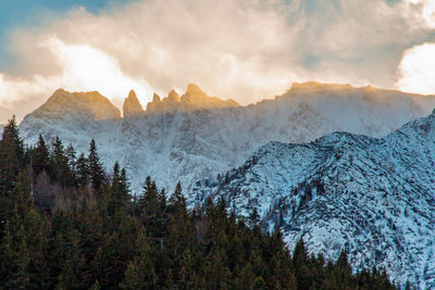 Scenic view of mountains against cloudy sky