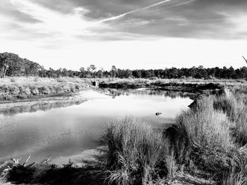 View of lake against cloudy sky