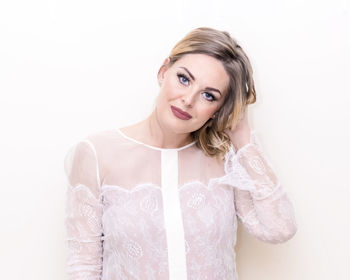 Portrait of a beautiful young woman over white background