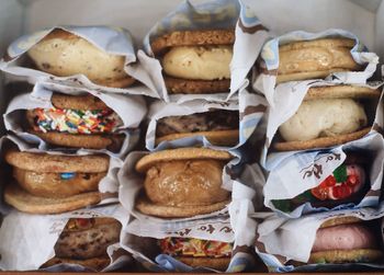 Close-up of desserts in packages stacked in store