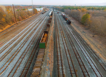 High angle view of railroad tracks by road in city