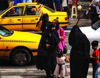 People standing on street in city