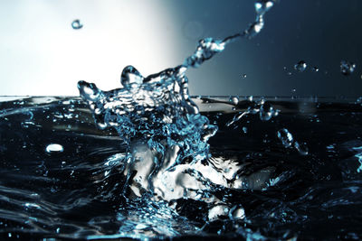 Close-up of water splashing against sky