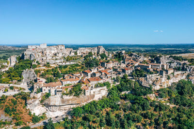 High angle view of townscape against clear blue sky
