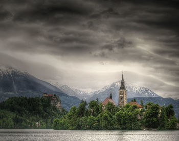 Scenic view of mountains against cloudy sky