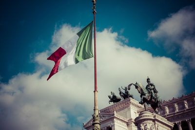 Low angle view of italian flag against sky