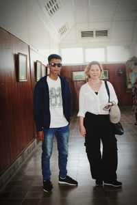 Portrait of friends standing on floor