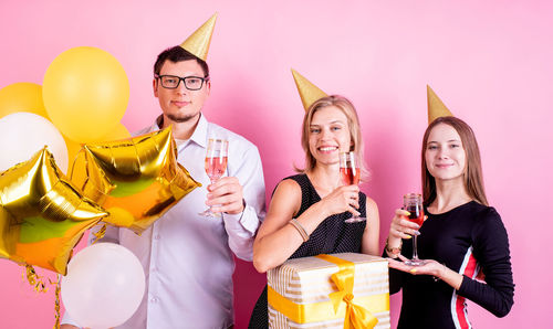 Group of people holding balloons