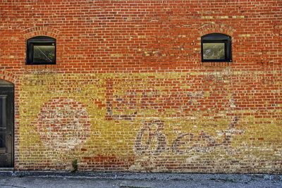Text on brick wall