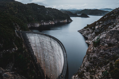 High angle view of dam by river against sky