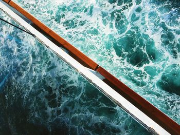 High angle view of sea waves reflecting on boat window