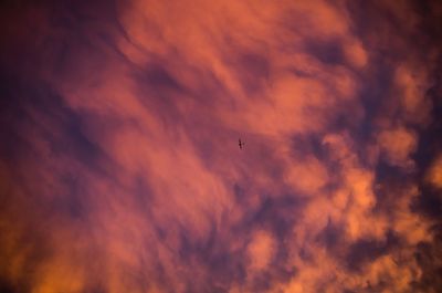 Low angle view of cloudy sky at sunset