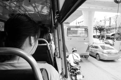 Rear view of people sitting in bus