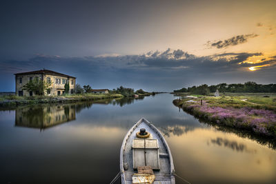 Scenic view of lake against sky during sunset