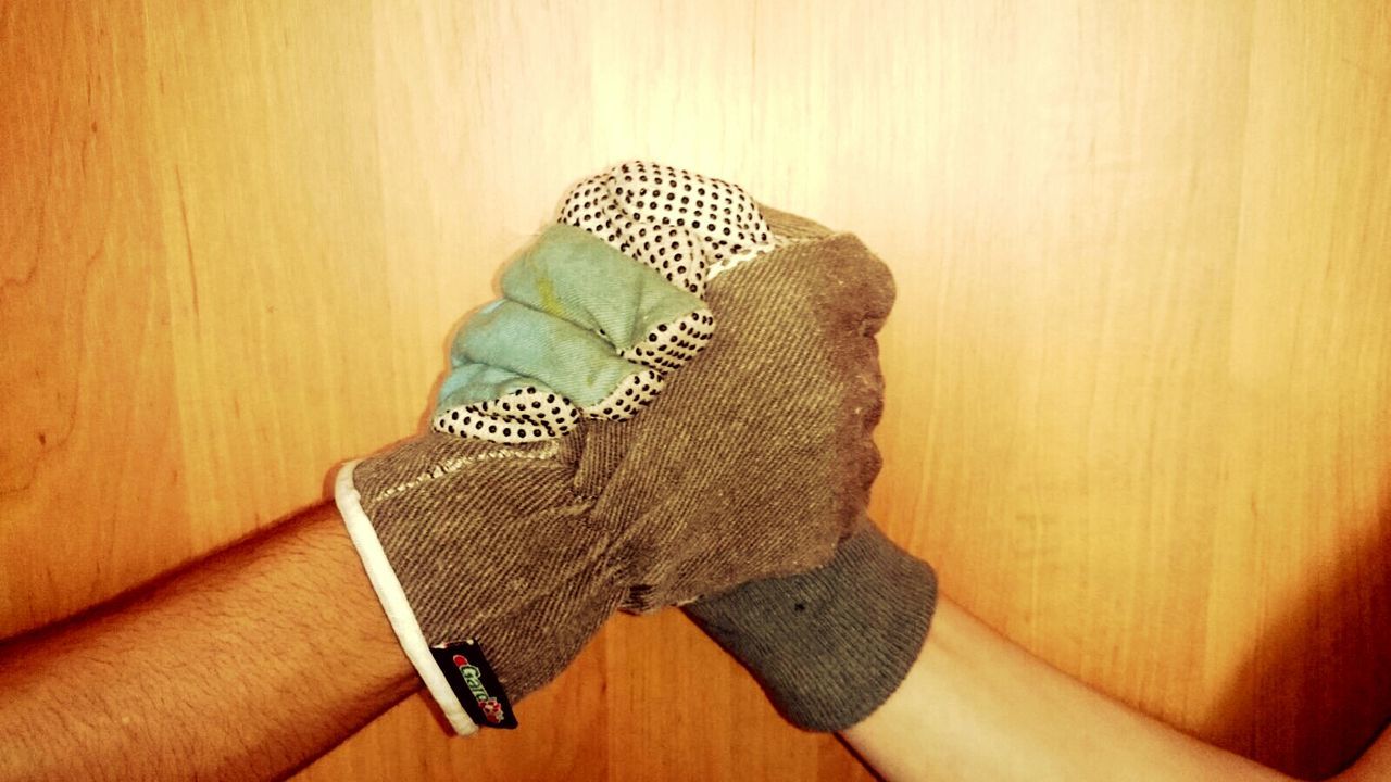 indoors, high angle view, table, person, part of, wood - material, personal perspective, still life, close-up, unrecognizable person, cropped, human finger, directly above, holding, home interior, flooring, hardwood floor