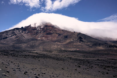 Scenic view of volcanic mountain against sky