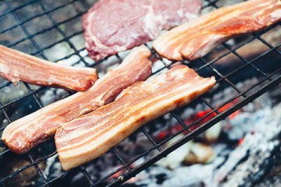 Close-up of meat on barbecue grill