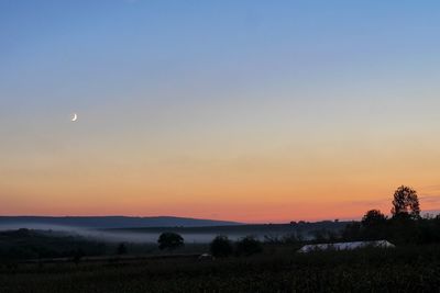 Scenic view of silhouette landscape against sky during sunset