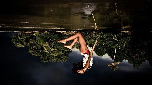 Reflection of woman in water