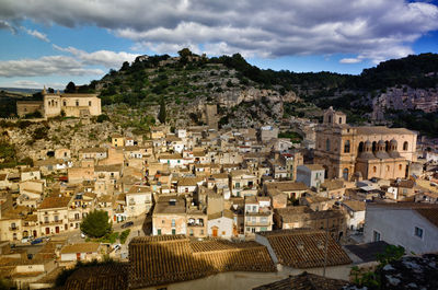 High angle view of townscape against cloudy sky