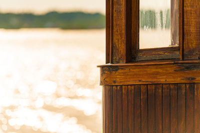 Close-up of window on wooden door