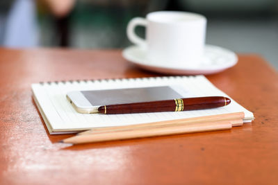 Close-up of coffee cup on table
