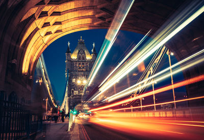 Light trails on road in city at night