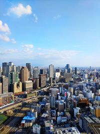 High angle view of buildings in city against sky