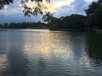 Scenic view of lake against sky at sunset