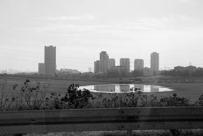 Buildings in city against sky