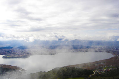 Scenic shot of mountain range against cloudy sky